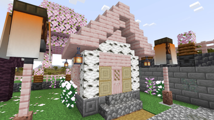 桜の木材とシラカバの原木の家